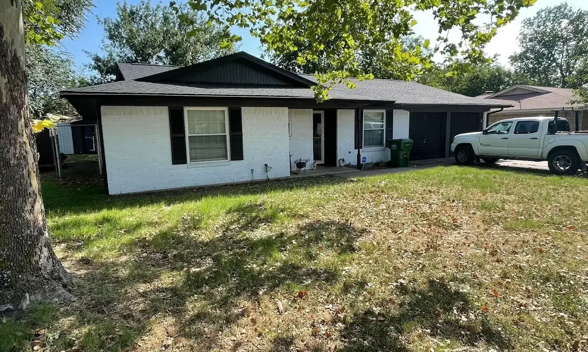 Professional roofing crew working on a residential roof in Decatur